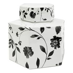 two white boxes with black flowers on them