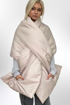 Minimalism is a timeless trend, and this winter shawl embodies it perfectly. Functional, practical, and versatile, it's designed for any occasion. Made from water-repellent outer fabric with a soft inner lining, this scarf is windproof, waterproof, and excellent at retaining warmth. Crafted with soft, cozy materials, it offers style and comfort effortlessly. Its large 20x85in size and convenient pockets make it perfect as a wrap, blanket, or stole. A thoughtful and warm gift for the season! Beige Puffer, Cape Scarf, Blanket Shawl, Winter Shawl, Large Scarf, Winter Gift, Warm Winter, Shawls And Wraps, Scarf Wrap