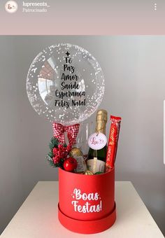 a red bucket filled with assorted items on top of a table