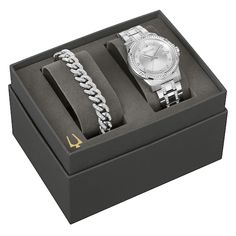 With elegance befitting his elevated style, this watch and bracelet gift set from Bulova is just what he wants. 42mm silver-tone stainless steel watch case and bracelet set with sparkling crystals Silver-tone sunray three-hand dial and 11 crystal hour markers Flat mineral crystal Watch bracelet secures with fold-over safety clasp Water resistant to 50 meters Completing the boxed set, the bold Cuban chain link bracelet shines with 260 pave-set crystals Jewelry Style Guide, Mens Watch Box, Tuning Fork, Jewelry Staples, Exude Confidence, Jared The Galleria Of Jewelry, Bracelet Box, Crystal Watches, Peoples Jewellers