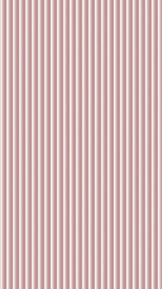 a pink wall with vertical lines on it