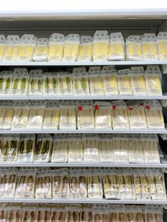 the shelves are filled with different types of food in plastic bags and packaged on them