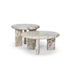 two marble tables sitting on top of each other