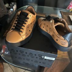 Cognac With Black Signature Logos On Sides With Black Bottom ( Cognac Shoe Strings & Dust Bags Included) Mcm Shoes, Cognac Shoes, Black Mcm Bag, Signature Logos, Black Bottom, Women's Sneakers, Black Bottoms, Black Logo, Signature Logo