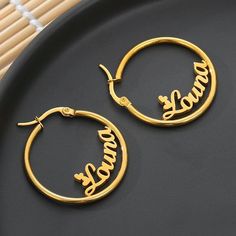 Lets make our lives more beautiful with custom/personalized items. This can bring you a lot of joy when you see your name or your loved once name on the item. Having your personal touch on a piece of jewelry really makes a difference. Item:- Old English Name Earrings Hoop Diameter:- 20-30-50-60-70 MM Metal:- Stainless Steel Finished:- Platinum-Rose Gold-Gold We have make 2 different name on1pair Please Explain your Name & Font No. On Personalization Box. Like This- Abdul Font #1 Processing a Custom Name Round Earrings For Personalized Gift, Custom Name Earrings For Personalized Gift, Personalized Small Hoop Earrings As Gift, Custom Name Small Hoop Earrings As Gift, Customizable Earrings For Anniversary, Customizable Round Earrings For Anniversary, Customized Earrings For Mother's Day, Personalized Earrings For Birthday, Personalized Round Earrings For Birthday