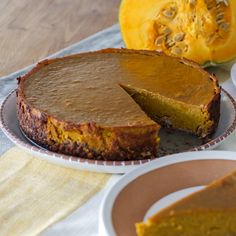 there is a pie on the table with two slices cut out and ready to be eaten