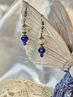 Sapphire with Multifaceted Rainbow Glass Earrings made with Czech glass beads.  Lovely details in each bead. Lead and nickel free, hypoallergenic.  Gift wrapping included and special orders welcome. Please check out my Etsy store for over 700 unique Earring and Necklace designs as well as hair accessories. Glass Beaded Earrings With Dangling Beads For Gift, Elegant Hypoallergenic Beaded Earrings With Czech Glass, Hypoallergenic Czech Glass Beaded Earrings For Gift, Adjustable Czech Glass Earrings With Faceted Beads, Glass Earrings With Faceted Beads As A Gift, Glass Earrings With Faceted Beads For Gift, Bohemian Blue Beaded Hypoallergenic Earrings, Bohemian Blue Hypoallergenic Beaded Earrings, Glass Faceted Beads Earrings For Gift