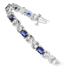 a bracelet with blue and white stones on the side, set in 18k white gold