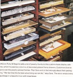 an advertisement for the jewelry store with drawers full of necklaces and bracelets on display