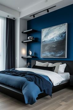 a bedroom with blue walls and white bedding