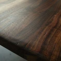 a close up of a wooden table with no one on it or in the background