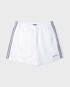 This one's for y2k sportswear lovers. These shorts are genuine champion from the early 2000s. Shorts are white and have grey/navy coloured striped sides. Has two front hand pockets and elasticated drawstring waistband. Iconic champion logo is printed near hem of left pant leg. Has inner netted layer for a comfy breathable fit. Good vintage condition- some slight discolouring and colour fading. Waist 31" Inseam 4.5" L Summer Sportswear Shorts With Side Stripes, Streetwear Athletic Shorts With Three Stripes, Streetwear Shorts With Three Stripes, Sporty Cotton Athletic Shorts With Three Stripes, Sports Shorts With Three Stripes, Three Stripes Sports Shorts, Sporty Three Stripes Athletic Shorts, Sporty Three-stripe Athletic Shorts, Three Stripes Shorts For Sports Events