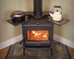 a stove with a tea pot on top of it