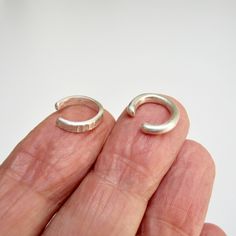 "NEW IN STORE! New item in the shop: ear cuffs in sterling silver. Two ear cuffs in combination, beautiful to wear together or individually, one rounded and smooth, the other with a texture of light vertical incisions. Comfortable, original, and perfect for everyday wear! Inner diameter 0,039\" Simple jewel, but made original by the craftsmanship, which adds value and characteristics to each of my pieces. Thanks for visiting and if you liked my jewels add the shop to your favorites so you will a Modern Handmade Ear Cuff For Gifts, Modern Silver Adjustable Cartilage Earrings, Silver Adjustable Modern Cartilage Earrings, Adjustable Modern Silver Cartilage Earrings, Modern Adjustable Silver Cartilage Earrings, Adjustable Hypoallergenic Sterling Silver Ear Cuff, Minimalist Silver Ear Climbers For Anniversary, Silver Ear Cuff For Anniversary, Silver Ear Cuff With Matching Earrings For Anniversary