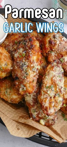 this is an image of garlic wings with parmesan sauce on top and the words garlic wings above it