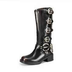 a pair of black boots with metal buckles