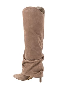 A slouchy shaft puts an exclamation point on the effortlessly chic design of a knee-high boot fashioned with a stiletto heel and pointy toe. 3 1/4" heel 15 1/2" shaft; 14 1/4" calf circumference Pull-on style Leather upper/textile and synthetic lining/synthetic sole Imported Closet Upgrade, Xmas Wishlist, Exclamation Point, Slouchy Boots, Fall 24, Fashion Runway, Disney Quotes, Marc Fisher, New Wardrobe