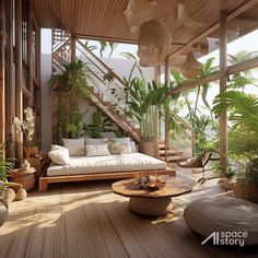 a living room filled with lots of plants next to a stair case and wooden floor