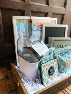 an assortment of food items in a wooden box