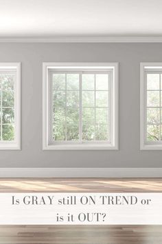 an empty room with three windows and the words is gray still on trend or is it out?