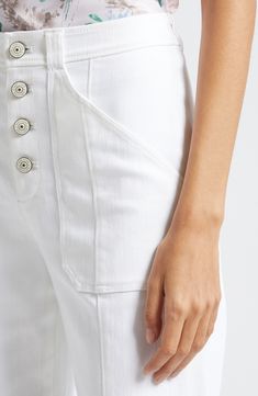 Hit refresh for white-jeans season with this wide-legged pair cut to a very cuffable length for extra trend-right style points. 28 1/2" inseam; 20 1/2" leg opening; 11" front rise; 15 1/2" back rise (size 8) Exposed-button fly Front patch pockets; back patch pockets 75% cotton, 25% polyester, 1% elastane Dry clean or machine wash, tumble dry Imported Modern White Cropped Leg Bottoms, White Cropped Leg Modern Bottoms, White Straight Hem Jeans For Summer, High Rise Bottoms With Button Cuffs For Spring, White Bottoms With Button Cuffs For Spring, Chic White Bottoms With Button Cuffs, Spring High Rise Bottoms With Button Cuffs, Spring White Bottoms With Button Cuffs, White Cropped Flare Jeans For Summer