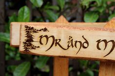 a wooden sign with the word rain on it