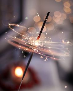 a sparkler is being blown by the wind