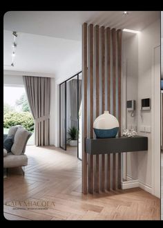 two pictures of a living room with wood paneling and glass doors that lead to the patio