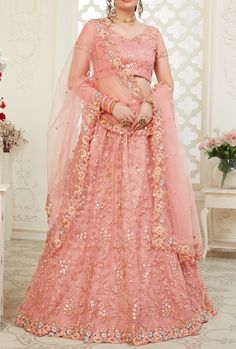 Latest Designer Bridal Wedding Wear Lehenga Choli. LEHENGA FABRIC: Net with Banglori Silk BLOUSE FABRIC: Net with Banglori Silk DUPATTA: Net COLOR: Peach WORK: Embroidery Bonus offer - Receive a free mystery gift with your order. Stitching Option - We will email you the measurement guide to confirm your size. SHIPPING: The product will be shipped within 1 - 2 weeks from the date of purchase. Product is returnable if un-Stitched This product qualifies for free shipping For any Rush/Urgent orders Peach Lehenga, Heavy Lehenga, Indian Lehenga Choli, Party Wear Lehenga Choli, Work Lehenga, Net Blouses, Lehenga Online, Net Lehenga, Lehenga Choli Online