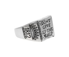 Straightforward and intriguing, this Digby & Iona signet ring is a modern version of the traditional. The surface is cast with the words ‘Dont Give Up The Ship’ paying homage to the immortal words emblazoned on the battle flag of Captain Oliver Hazard Perry aboard the USS Niagara in 1813. sterling silver ring face : 1/2" x 1/2"sterling silver band width : 4.5mmsize available : 9please contact us for sizing options Digby And Iona, Jennie Kwon, Battle Flag, Zoe Chicco, Cathy Waterman, Creating Jewelry, The Ship, Don't Give Up, Sterling Silver Bands