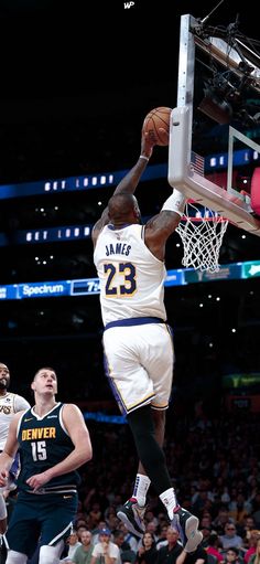 a basketball player dunking the ball into the hoop