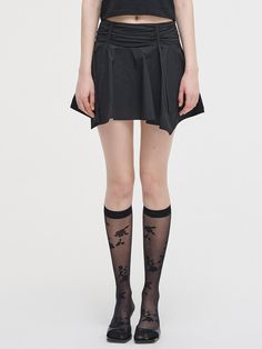 This is a trendy and feminine skirt by ETMON that is made out of high quality and sturdy material. With distinctive mood of the design and modern feminine look, you can style it for your casual daily outfit.- Natural shirring and drape detail- Unique irregular hem- Feminine and trendy look Fitted Black Bottoms With Pleated Hem, Black Pleated Hem Skort For Spring, Black Pleated Skirt With Pleated Hem For Spring, Black Spring Skort With Pleated Hem, Black Pleated Hem Bottoms For Spring, Black Bottoms With Pleated Hem For Spring, Fitted Black Skirt With Pleated Hem, Stretch Skirt With Folds, Black Pleated Hem Skirt For Night Out