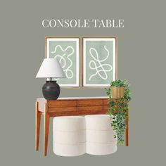 the console table is next to two lamps and a potted plant in front of it