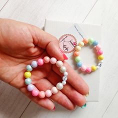 This listing is for 1 Colorful children's bracelet. Colorful plastic 6 and 8 mm beads were used to make the bracelet. strong elastic and letters of your choice. Please enter 1. the desired letter, 2. the child's age or arm circumference 3. choose color arrangement number 1 or 2 Important! The bracelet is NOT suitable for small children due to the small parts that can be swallowed!  Please select a size! !! Caution !! The model shown is for a 5-6 year old child! If different than this size, it is White Plastic Stretch Bracelet As Gift, Plastic Stretch Bracelet With Round Beads As Gift, Trendy Hypoallergenic Stretch Bracelet For Birthday, Cute Plastic Stretch Bracelet As Gift, Plastic Stretch Bracelet With Round Beads For Gift, Cute Plastic Stretch Bracelet Gift, Cute Round Stretch Bracelet As Gift, Playful Personalized Stretch Bracelet With Round Beads, Cute Stretch Bracelet With Round Beads For Gift