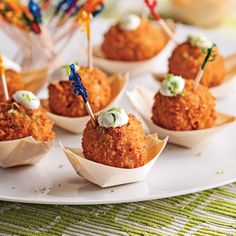 small appetizers with toothpicks in them on a plate