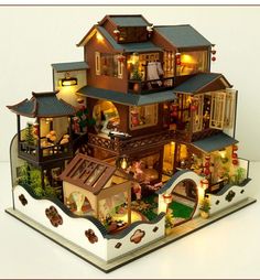 a doll house with lots of furniture and lights