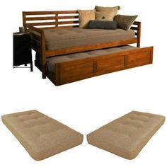 the daybed is made out of wood and has two drawers underneath it, along with matching footstools