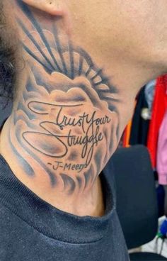 a man with a neck tattoo that says trust your struggle