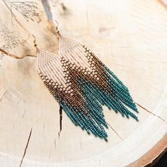 a close up of a piece of wood with beads on it