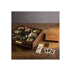 a wooden box filled with cards and other items