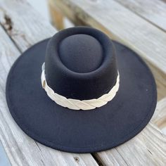 These wide brim hat exudes rustic sophistication to carry out western cowgirl looks woven with hints of chic bohemian style. The felted fedora hat is equal parts comfortable and fashionable. size adjustable 90% polyester, 5% cotton, 5% wool height: 4 ½” circumference: 24” brim width: 3 ½” Western Braided Fedora Hats, Braided Wide Brim Hat For Ranch, Western Style Sun Hat For Rodeo In Fall, Chic Adjustable Hat Bands For Country Events, Braided Western Fedora Hats, Wide Brim Braided Hat For Ranch, Country Style Wide Brim Boater Hat For Country Events, Chic Brimmed Sun Hat For Fall, Chic Wide Brim Sun Hat For Fall