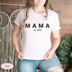 Show off your love and excitement for the upcoming arrival of your newest family member with our Mama est 2023 Tee. Crafted from high-quality materials, this comfy and stylish tee is the perfect pregnancy announcement. Click to buy now and start looking forward to the day your little one arrives. Little One