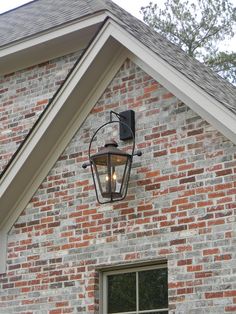 a brick building with a light on the side