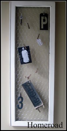 a white door with magnets and pictures on it