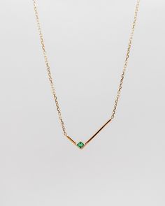 This minimalist solid gold necklace features a simple geometric L shape gold bar with a single square shape emerald, for an asymmetrical look that's both simple and strikingly graphic. The piece looks equally good worn alone or stacked with other styles.details: 18k yellow gold the square shape emerald is measured 2mm x 2mm the L shape is measured 8mm x 16.5mm 18” length with 2” extender spring-ring closure One piece in 18k yellow gold in stock, ready to ship! Pendant Necklace Simple, Square Necklace, Solid Gold Necklace, Jewelry Accessories Ideas, Gold Bar Necklace, Coral Jewelry, Classy Jewelry, Emerald Necklace, Jewelry Design Necklace