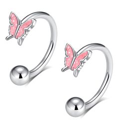 two pink butterfly shaped nose rings on top of each other, one with a ball