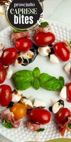 a white plate topped with lots of different types of veggies on skewers