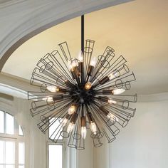 a chandelier hanging from the ceiling in a room