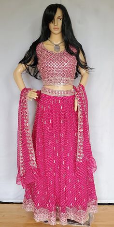 Shop for this beautiful pink colored lehenga in bandini print with croptop. This lehenga comes with satin lining and cancan. Available Size - L (40) Sleeves available ( Please check inside the dress for sleeves ) There may be minor variations in the color, the texture of the product. Color/textures show differently based on lighting. Bollywood Style Bandhani Print Sharara For Reception, Bollywood Style Pink Sets With Gota Work, Pink Gota Work Sets For Navratri, Pink Sets With Gota Work For Navratri, Pink Anarkali Choli With Gota Work, Fitted Pink Anarkali Set With Gota Work, Anarkali Choli With Bandhani Print For Reception, Pink Fitted Sharara With Gota Work, Fitted Pink Sharara With Gota Work