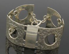 "925 Sterling Silver - Vintage Shiny Hammered Square Chain Bracelet - BT5357  925 Sterling Silver - Vintage Shiny Hammered Square Chain Bracelet - BT5357  Jewelry Type:         Bracelet   Metal Type:            925 Silver  Metal Size:             7.75\" Length  1\" Height   Stone Type:            N/A  Condition:              N/A  Jewelry Weight:     47.1 Grams  PLEASE NOTE: THIS ITEM IS PRE-OWNED. ALTHOUGH MOST ITEMS ARE IN VERY GOOD CONDITION, SOME MAY NEED CLEANING AND/OR MINOR REPAIRS. WE MAKE A VERY STRONG EFFORT TO UPLOAD CLEAR PICTURES. PLEASE INSPECT ALL PICTURES AND ASK ALL QUESTIONS YOU MAY HAVE PRIOR TO MAKING A PURCHASE. NOT ALL STONES ARE GENUINE, SOME ARE ENHANCED OR CREATED." Contemporary Sterling Silver Bracelet In Silver, Handmade Silver Modernist Bracelets, Modern Sterling Silver Bracelets For Jewelry Making, Contemporary Handmade Jewelry Bracelet, Contemporary Handmade Silver Bracelet, Handmade Contemporary Silver Bracelet, Contemporary Hammered Silver Jewelry, Modernist Sterling Silver Bracelet Gift, Modernist Sterling Silver Bracelet As Gift